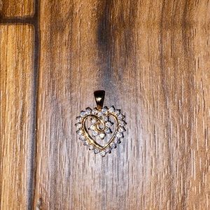 Gold plated necklace pendent with diamonds on it